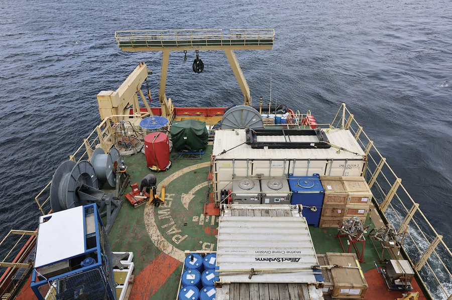 Boxes, crates, and barrels of scientific equipment crowd the deck of R/V Nathaniel B. Palmer. Credit: Sofia Moutinho
